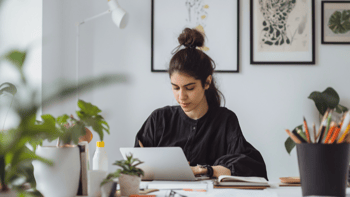 Young Woman Working on Laptop in Home Office-1-1